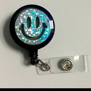 Holographic smiley face clip on badge reel key card holder
